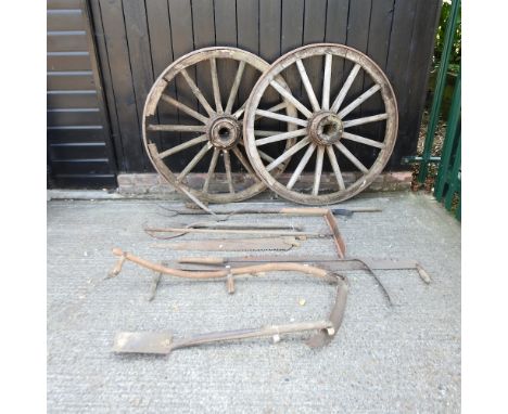 A pair of antique wooden cartwheels, each 120cm diameter, together with a collection of vintage hand garden tools