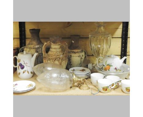 Two shelves of items, to include Royal Worcester Evesham pattern tea wares, together with a glass lamp and three African pots