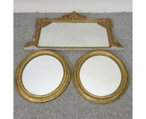 A pair of 19th century gilt oval wall mirrors 57 x 49cm, together with a gilt over mantel mirror