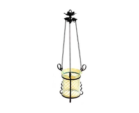 VICTORIAN ARTS & CRAFTS IRON HALL LANTERN WITH A VASELINE GLASS SHADE WITH SCALLOPED TOP AND BRASS PULL CHAINS.HEIGHT: 15 INC