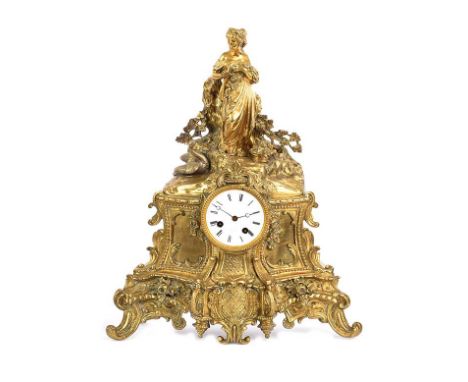 FRENCH GILT METAL MANTEL CLOCK WITH CIRCULAR DIAL OF 3½ INCHES.P MERLE, PARIS.JAPY FRERES MOVEMENT.HEIGHT: 18 INCHES.WIDTH: 1