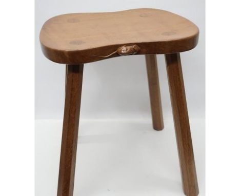 Robert Mouseman Thompson - an oak Cow stool, shaped rectangular adzed top on four out splayed octagonal supports, carved mous