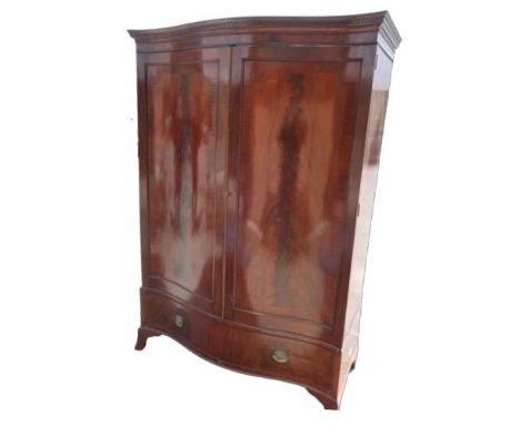 Geo. III style mahogany serpentine front wardrobe, with Greek key cornice above a pair of  crossbanded doors, single drawer b