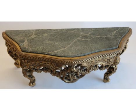 Chippendale style giltwood pier mirror, shaped plate with basket work and C scroll cresting, the green marble top serpentine 