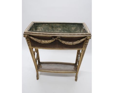 Regency style giltwood rectangular two-tier jardiniere with canework panels and laurel drapery decoration, on scale carved sh