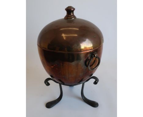 Unusual Arts and Crafts copper and wrought metal fuel bin and cover, egg shaped body with capstan finial and shaped ring hand