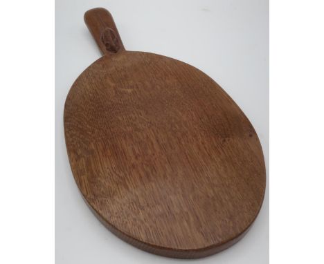 Robert Mouseman Thompson - an adzed oak oval cheeseboard, handle carved with signature mouse  L37cm 