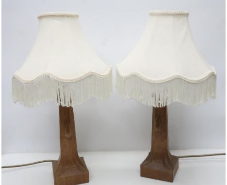 Robert Mouseman Thompson - a pair of adzed oak octagonal table lamps, on leaf carved square bases carved with signature mouse