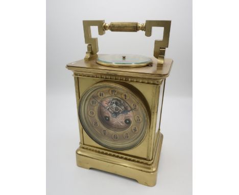 Late 19th Century French brass large carriage clock with aneroid barometer, chaptering set with Roman numerals, visible lever