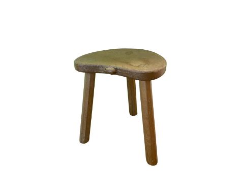 Robert Mouseman Thompson - an oak Calf stool, adzed kidney shaped top on four faceted outsplayed supports, carved mouse signa