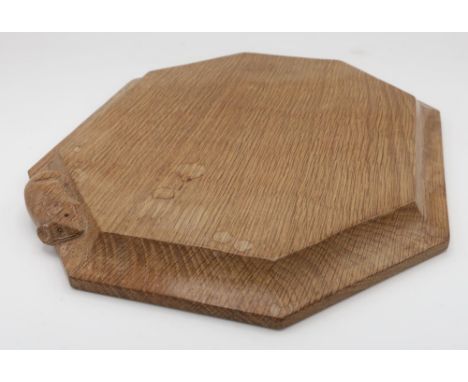 Robert Mouseman Thompson - an adzed oak bread board, carved with signature mouse, W30.5cm D25cm 