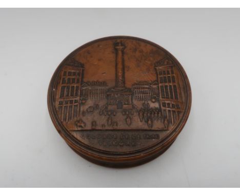 19th C French burr maple circular snuff box, the lid pressed with a view of the Colonne De La Plac Vendome, on engine turned 