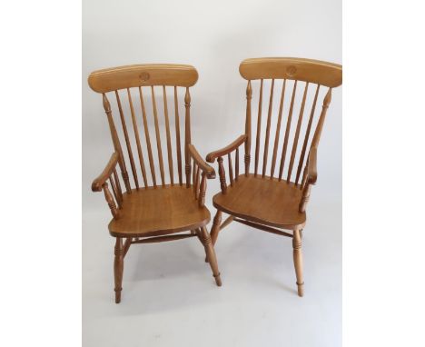 Andrew Conning Butterfly Furniture - a pair of Victorian Windsor style oak elbow chairs with stick turned backs and shaped sa