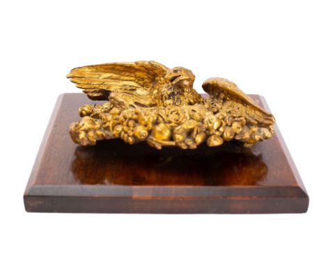 An English or French gilt-bronze model of a spread eagle capturing a hare, late 19th century, the naturalistically modelled a