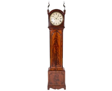 A Georgian flame mahogany longcase clock having an eight-day duration, five-pillar movement striking the hours on a bell, the