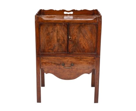 A George III mahogany tray top commode, circa 1770 and later adapted; the serpentine three quarter gallery pierced at the sid