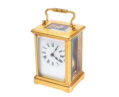 A small French Victorian carriage clock having an eight-day duration timepiece movement with a silvered platform lever escape