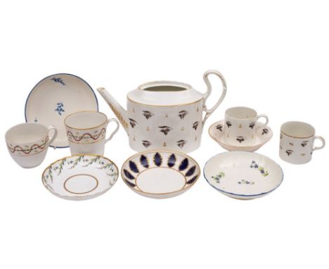 A group of Pinxton porcelain wares including a silver-shape teapot [lacking cover] with two matching cans and a saucer; four 