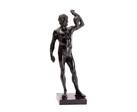 A Continental black patinated bronze model of a deity or mythological figure, possibly Mars, holding the head of a woman, lat