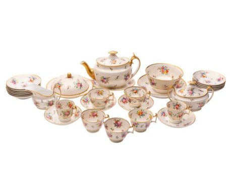 An extensive Spode porcelain part tea service painted with floral sprays and sprigs on a gilt dot ground, iron-red marks and 