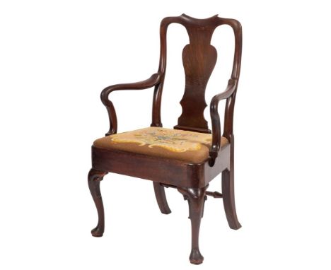 A George II mahogany elbow chair, mid 18th century; the backrest with vase form splat above crook arms; with tapestry upholst
