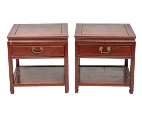 A pair of Chinese stained hardwood sofa or bedside tables, 20th century; the square cleated tops with moulded edges; each wit