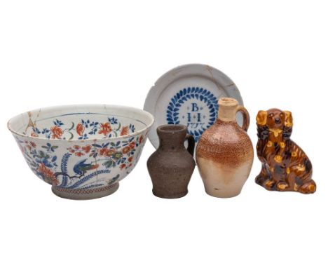 A mixed lot of pottery comprising an English dated blue and white delftware plate inscribed 'B.I.I 1717' within a foliate car