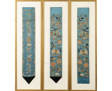 A set of three Chinese silk and metal thread embroidered cuffs or robe segments, early 20th century, the blue grounds embroid