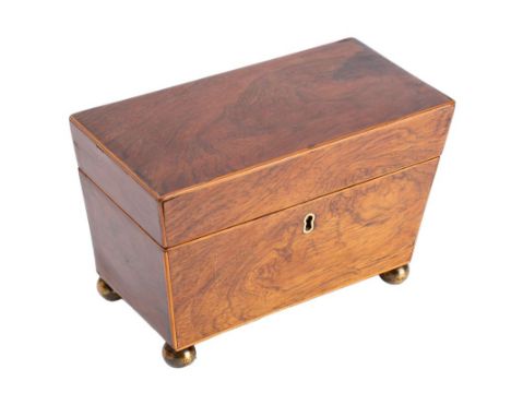 A late George III walnut, sycamore strung and brass mounted tea caddy, circa 1800, of tapered sarcophagus form, the hinged co