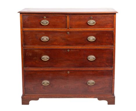 A mahogany chest of drawers, second quarter 19th century; the top with moulded front and side edges; above two short and thre