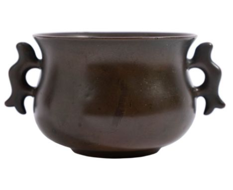 A small Chinese bronze censer of bombe form with flattened loop handles, apocryphal four-character Xuande seal mark, Qing Dyn