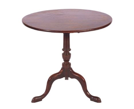 A George II mahogany flip top tripod occasional table, mid 18th century; the circular top and block on a knop turned and wais