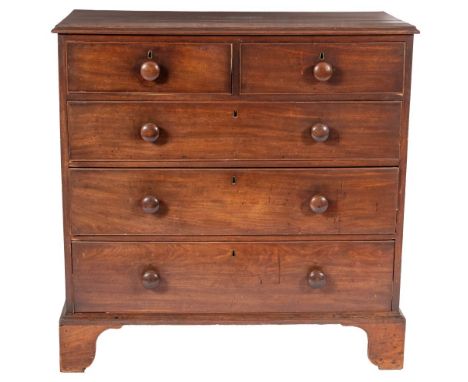 A George III mahogany chest of drawers, late 18th century; the top with ogee moulded edges above two short and three graduate