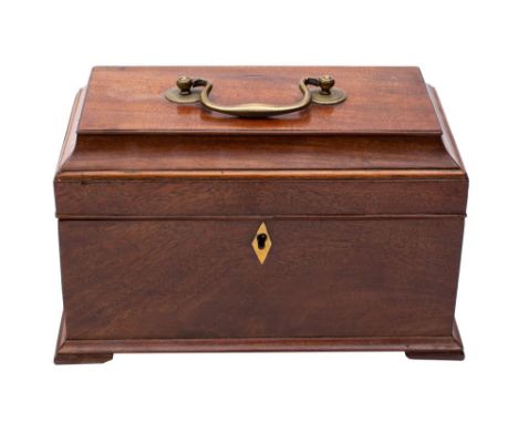 A George III mahogany veneered and brass mounted tea caddy, third quarter 18th century, of sarcophagus form, the hinged cover