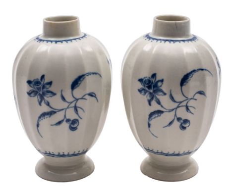 A pair of First Period Worcester blue and white tea canisters of baluster fluted form painted in the Narcissus pattern betwee