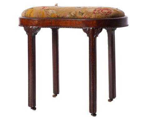 A George II mahogany commode stool, mid 18th century and later upholstered; of waisted oval section; the seat with tapestrywo