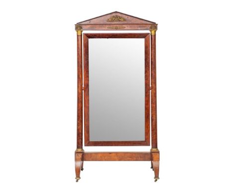 A fine Empire mahogany cheval mirror, early 19th century; the triangular pediment with applied bronze relief of Muses reclini