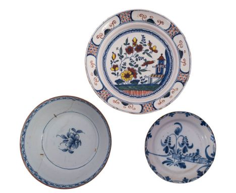 Three pieces of 18th century English delftware comprising a polychrome charger painted in the oriental style with a pagoda, f