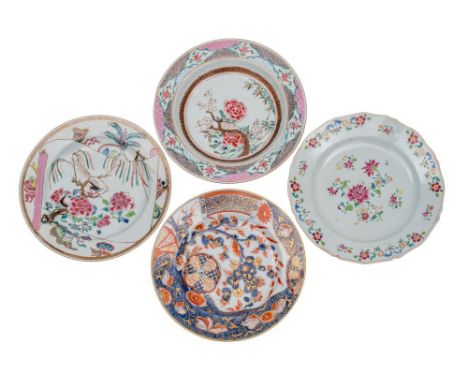 A group of three Chinese famille rose plates and a Chinese Imari plate painted with birds, floral sprays and foliage, one wit