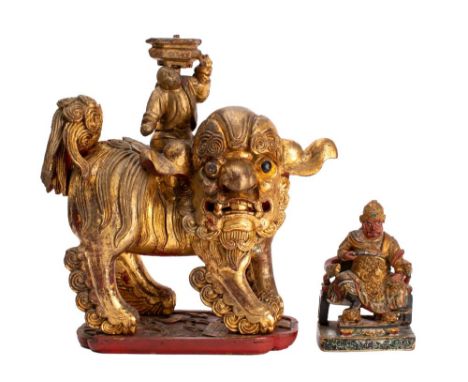 Two Chinese gilt and polychrome carved wood figures, Qing Dynasty and later the first of Guandi seated on a dragon throne, 15