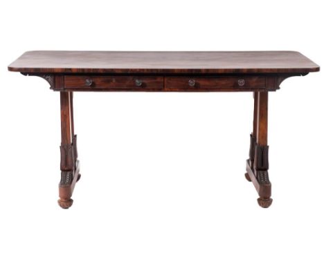 A Regency rosewood sofa table, circa 1815; the rectangular top with rounded corners; above two shallow drawers to the front a