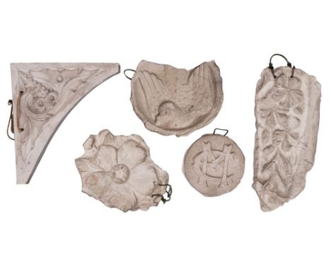 A group of sixteen plaster casts of architectural ornament, mostly early 20th century, comprising a rectangular plaque cast w