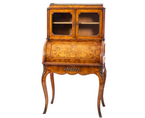 A walnut and crossbanded bureau de dame in Louis XV style, last quarter 19th century; the caddy top with gilt metal three qua