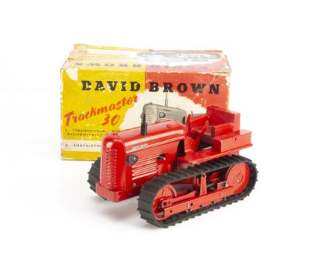 A Scarce Shackleton Toys Mechanical David Brown Trackmaster 30 Tractor, red body, black tracks, produced in 1952 as a promoti