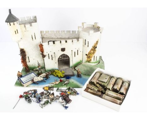 A selection of Timpo medieval knight figures with a plywood castle on base and a Crescent tin plate castle, plywood castle lo
