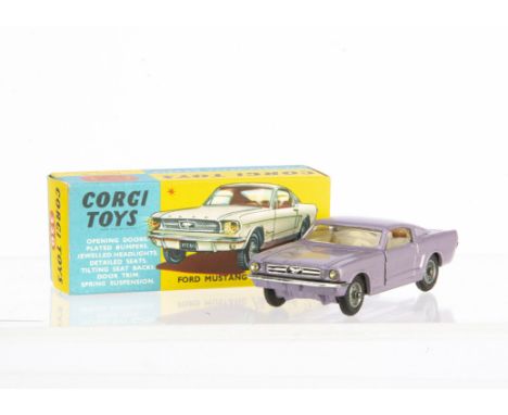 A Corgi Toys 320 Ford Mustang Fastback 2+2, metallic lilac body, cream interior, wire wheels, in original box with club leafl