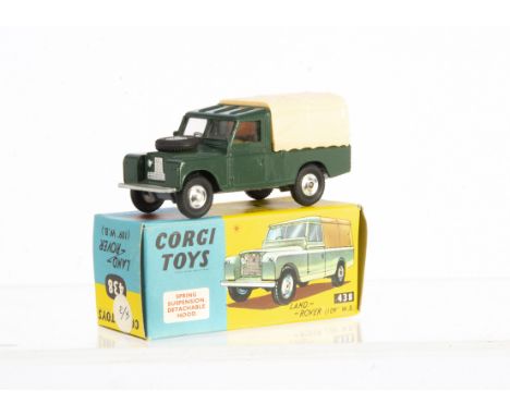 A Corgi Toys 438 Land Rover 109" W.B, dark green body, lemon interior, cream plastic canopy, spun hubs, in original box with 