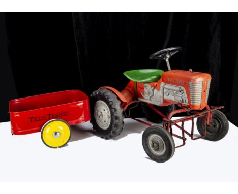 A Tri-ang TM2010 Harvester Pedal Tractor, as shown in the 1964 Tri-ang catalogue, red plastic body, silver detail, black 'tub