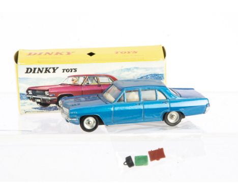 A French Dinky Toys 513 Opel Admiral, metallic blue body, off white interior, three pieces of luggage, concave hubs, in origi