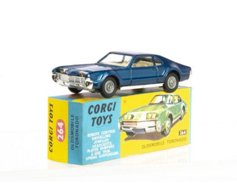 A Corgi Toys 264 Oldsmobile Toronado, metallic dark blue body, cream interior detailed cast hubs, in original box with club l